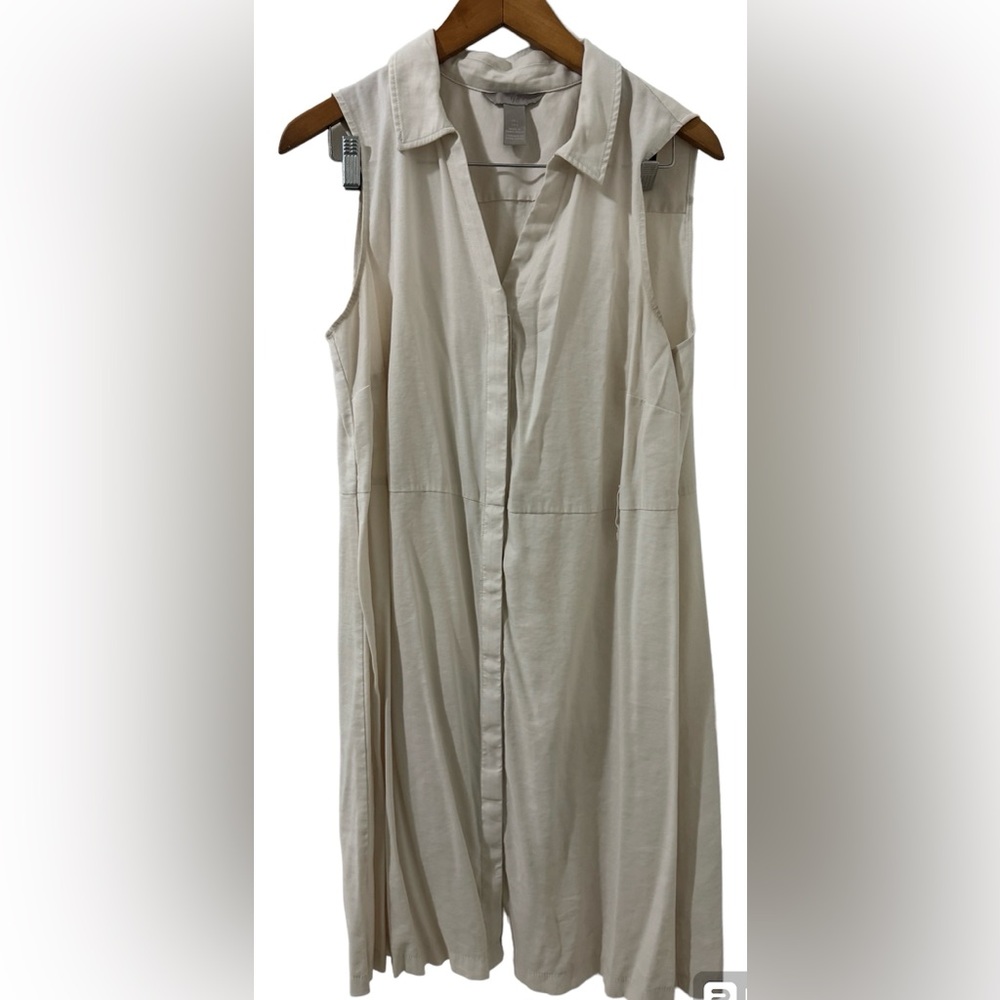 H&M sleeveless pink dress with collar and belt loops.